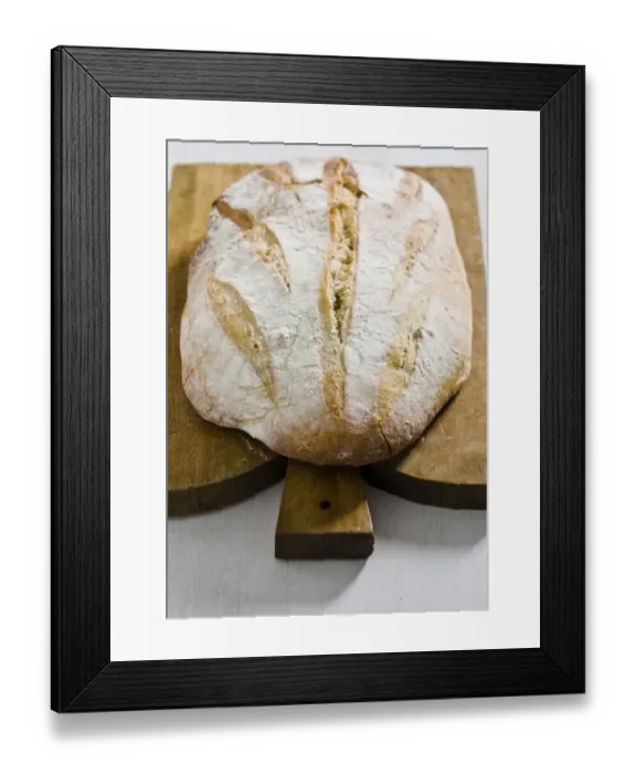 Framed Print : Organic rustic white loaf on wooden cutting board credit: Marie-Louise Avery / Framed Print : Organic rustic white loaf on wooden cutting board credit: Marie-Louise Avery /