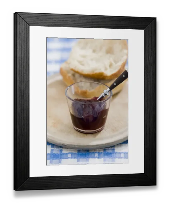 Framed Print : Small glass bowl of seedless raspberry jam with crusty bread on old scrubbed board Framed Print : Small glass bowl of seedless raspberry jam with crusty bread on old scrubbed board