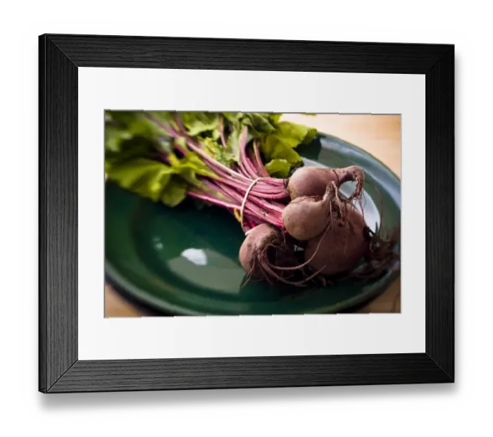 Framed Print : A bunch of freshly dug, whole beetroot on dark green plate. credit: Marie-Louise