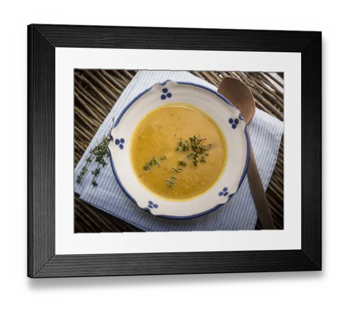 Framed Print : Soup of squash roasted with garlic and thyme, served in blue and white bowl with Framed Print : Soup of squash roasted with garlic and thyme, served in blue and white bowl with