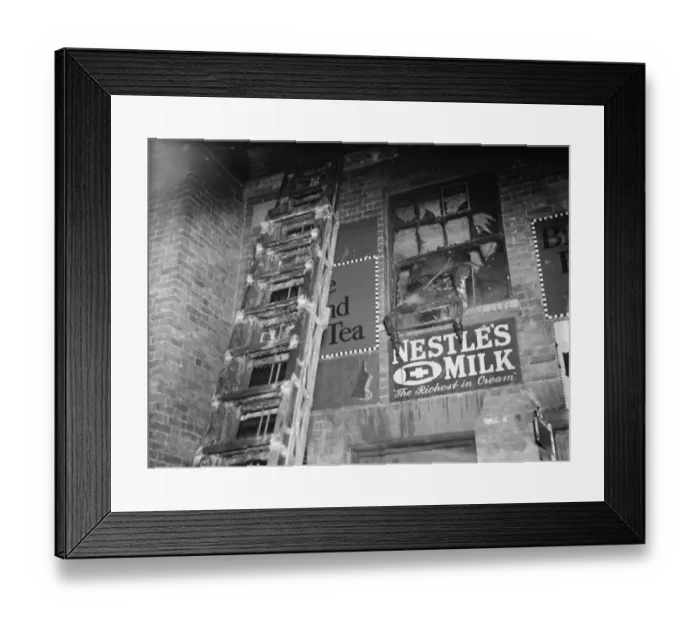 Framed Print : The fire brigade dealing with a fire at a Foots Cray shop in Kent. A ladder up
