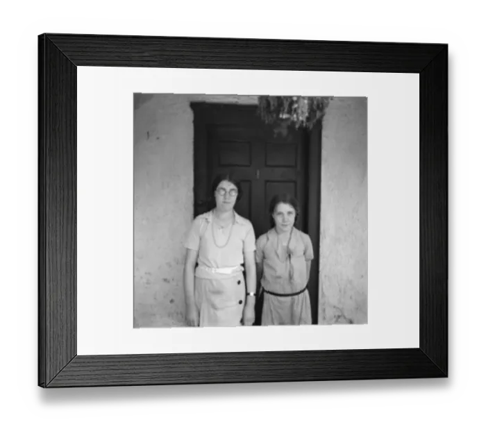 Framed Print : Two sisters pose in front of a cottage. 1936