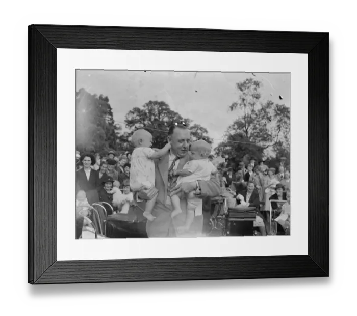 Framed Print : Sidcup Jubilee fete. Mr W Brown holds up twins at the baby show. 1939 Framed Print : Sidcup Jubilee fete. Mr W Brown holds up twins at the baby show. 1939