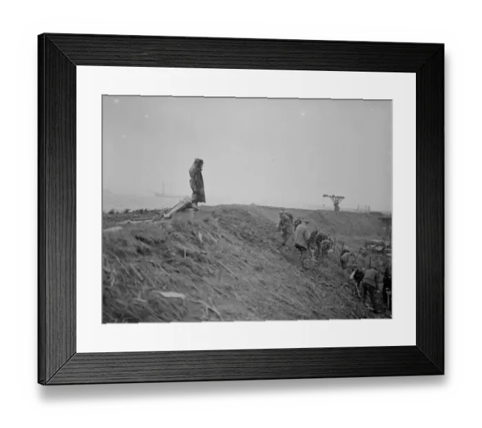 Framed Print : Workers maintaining the river defences and doing repairs on the river wall and embankment