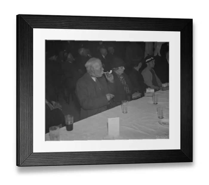Framed Print : An elderly gentleman smokes his clay pipe at the old folks party at Crayford, Kent Framed Print : An elderly gentleman smokes his clay pipe at the old folks party at Crayford, Kent