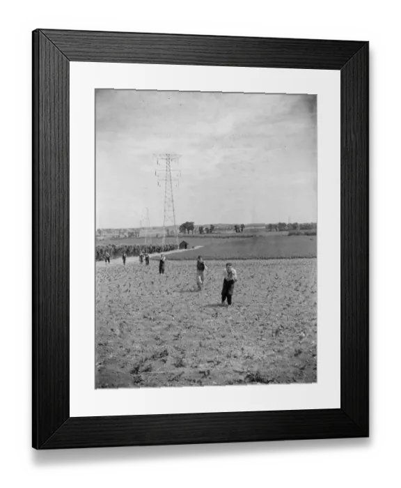 Framed Print : Erecting electricity pylon wires on a grid in Gravesend, Kent. 1939 Framed Print : Erecting electricity pylon wires on a grid in Gravesend, Kent. 1939