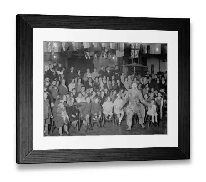 Framed Print : Children watch enthralled as a clown balances an umbrella on his nose at the Territorial Framed Print : Children watch enthralled as a clown balances an umbrella on his nose at the Territorial