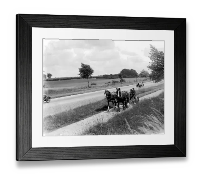 Framed Print : Country roads were almosts empty of traffic. Here in 1936 a car passes a horsedrawn mower Framed Print : Country roads were almosts empty of traffic. Here in 1936 a car passes a horsedrawn mower