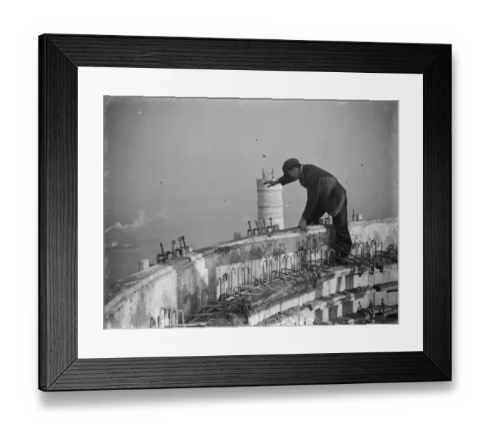 Framed Print : A workman waves down from one of the chimneys of the new coal electric power station