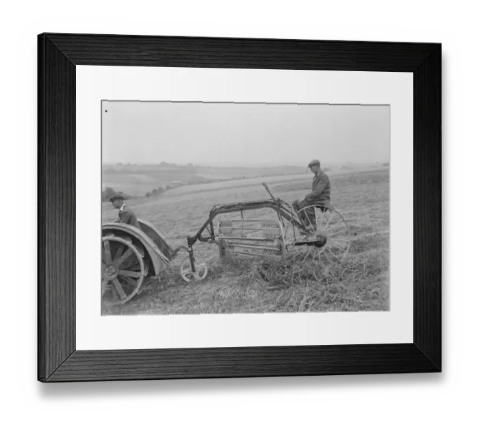 Framed Print : Farmers using a new tractor drawn haymaking machine on a field in Farningham, Kent