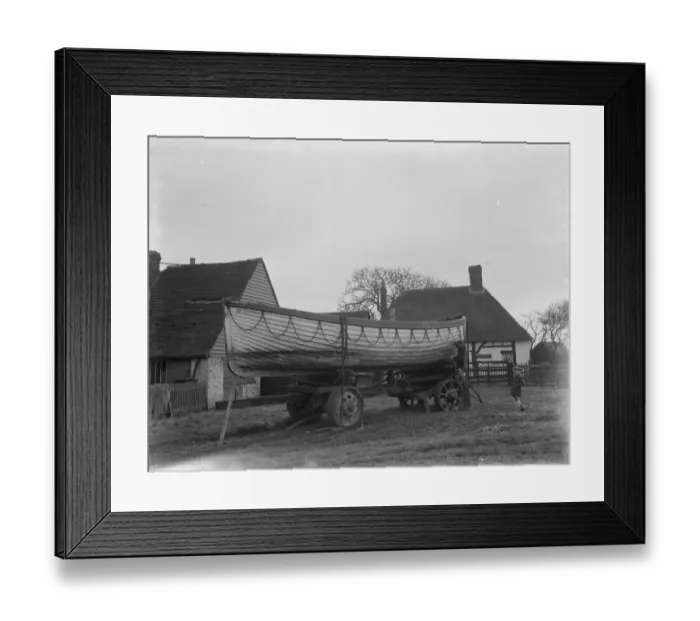 Framed Print : A policeman builds a boat on the village green in Faversham, Kent. 1937