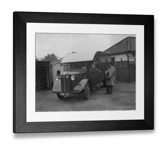 Framed Print : Men carrying the totalisators from a Bedford truck at Hurst Park Racecourse in Molesey Framed Print : Men carrying the totalisators from a Bedford truck at Hurst Park Racecourse in Molesey