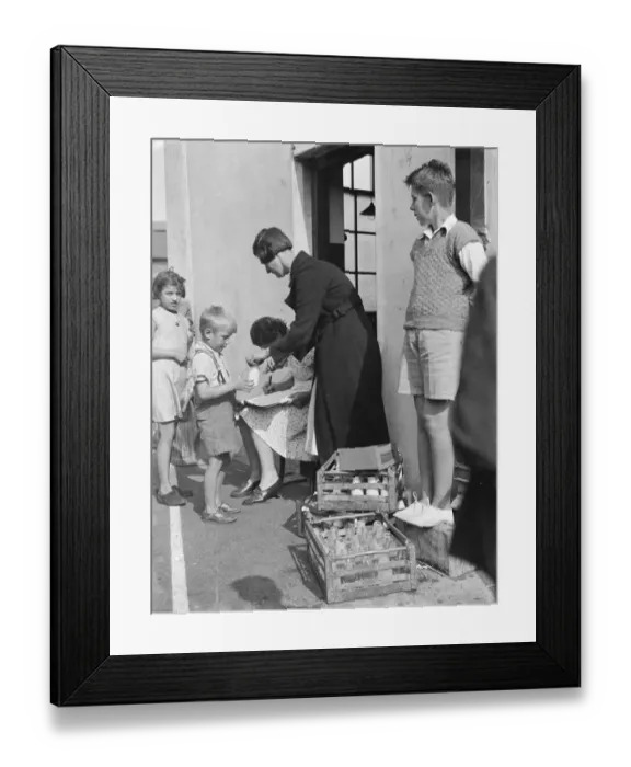 Framed Print : Free milk for children on holiday in Crayford, Kent. A woman is collecting Framed Print : Free milk for children on holiday in Crayford, Kent. A woman is collecting