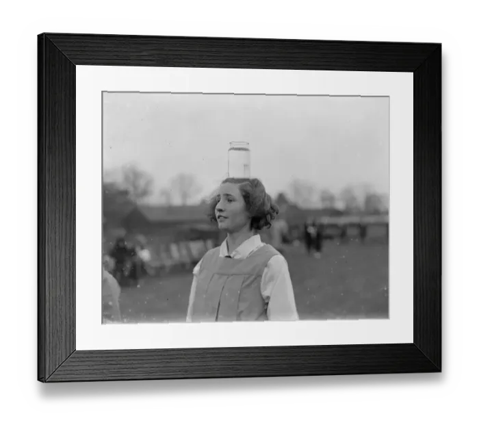 Framed Print : Girl balances a jar of water on her head. 1935 Framed Print : Girl balances a jar of water on her head. 1935