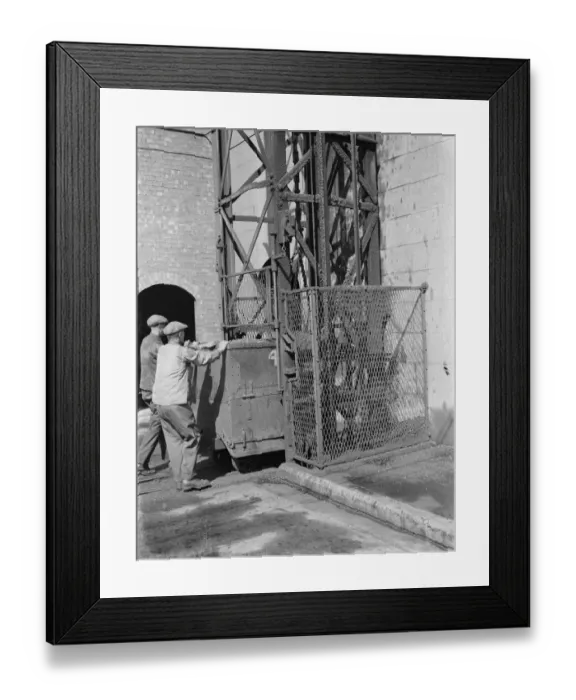 Framed Print : Gravesend Gasworks in Kent. Loading gas coal into retorts. 1939 Framed Print : Gravesend Gasworks in Kent. Loading gas coal into retorts. 1939