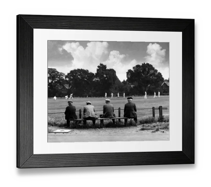 Framed Print : Elderly men sitting on a bench watching a local cricket match