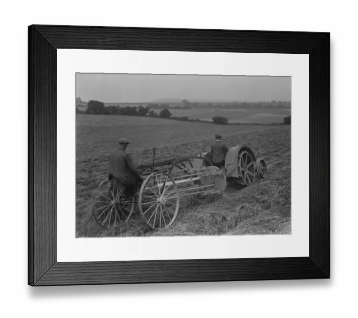 Framed Print : Farmers using a new tractor drawn haymaking machine on a field in Farningham, Kent