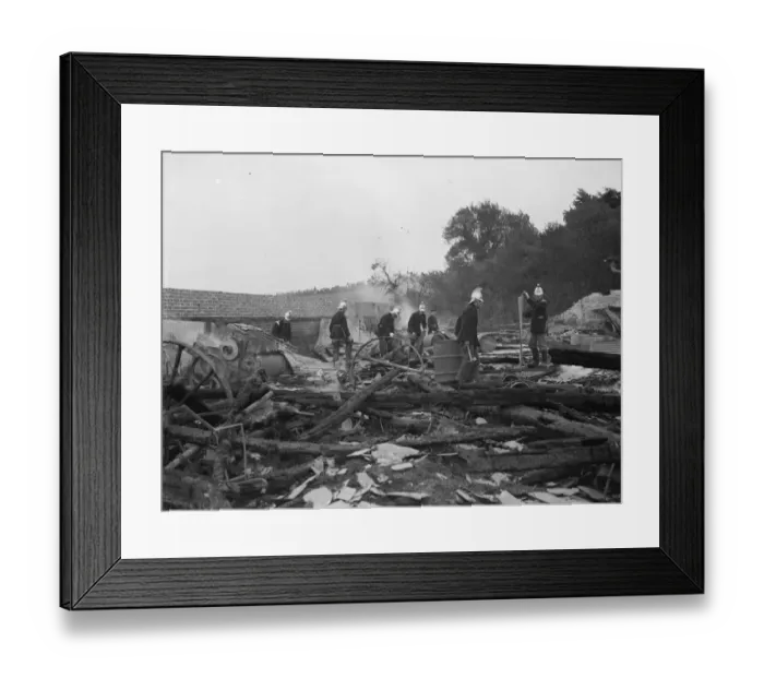 Framed Print : Padham farm fire in Swanley. Fireman work through the charred remains Framed Print : Padham farm fire in Swanley. Fireman work through the charred remains