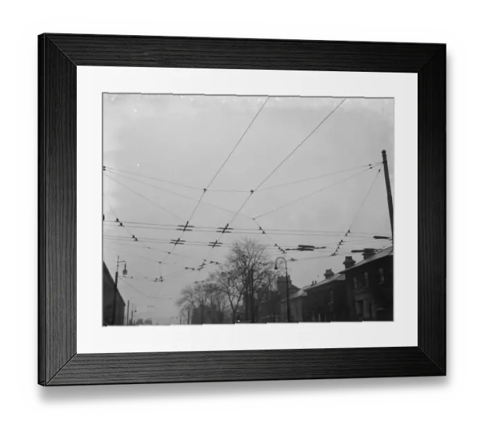 Framed Print : Overhead electrical trolleybus wires. 1937