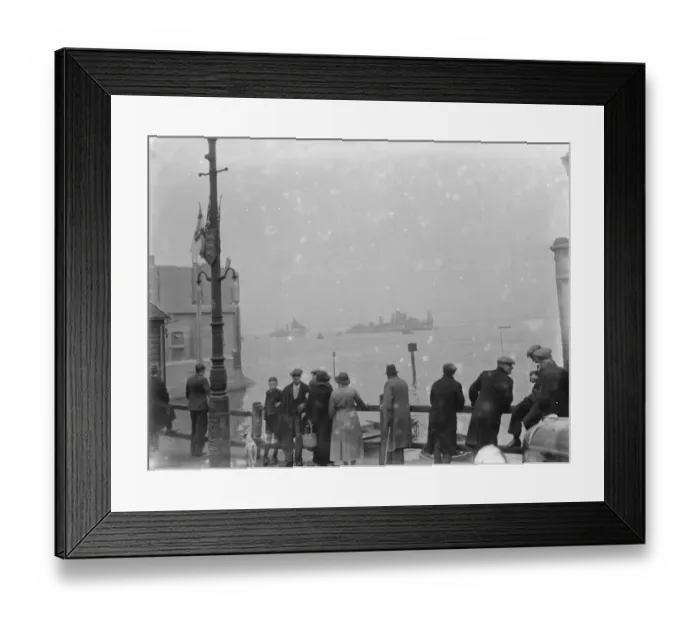 Framed Print : People gather on the river side to watch the Home Fleet on the Thames at Erith, London