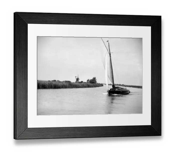 Framed Print : The Broads, Norfolk. Wherry sailing on a river / canal, a windmill in the background 1934 Framed Print : The Broads, Norfolk. Wherry sailing on a river / canal, a windmill in the background 1934