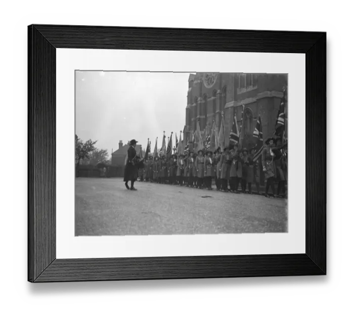 Framed Print : Girl guides during their church parade in front of the Parish Church of St John Framed Print : Girl guides during their church parade in front of the Parish Church of St John
