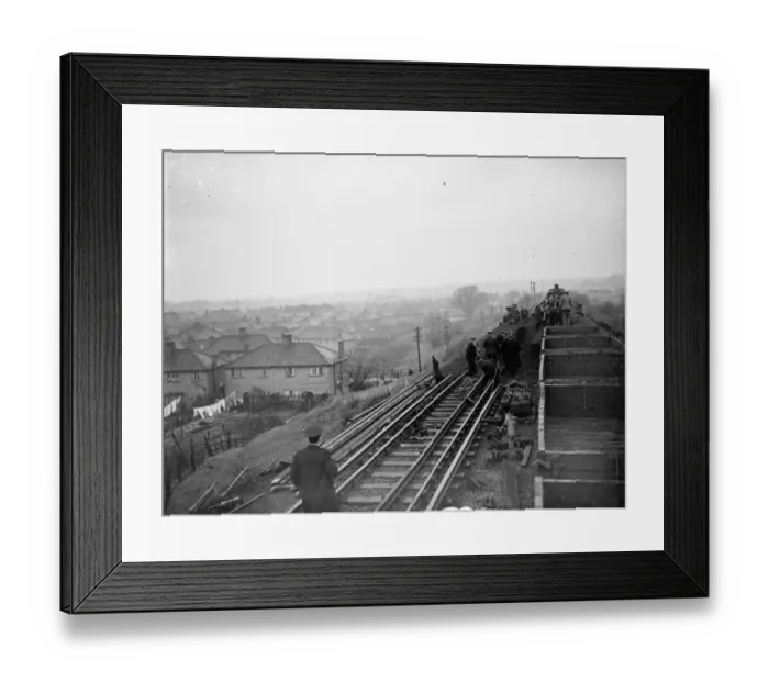 Framed Print : Rail workers work to clear the land slide and re lay track on the Wellhall line Framed Print : Rail workers work to clear the land slide and re lay track on the Wellhall line