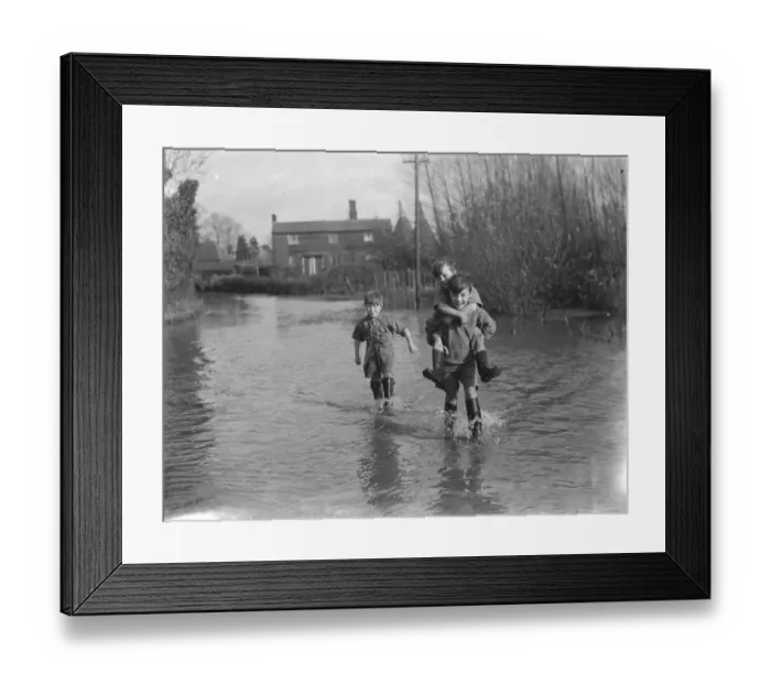 Framed Print : Boys wade through the floods in Beltring, Kent. 1936