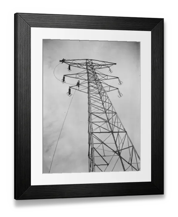 Framed Print : Erecting electricity pylon wires on a grid in Gravesend, Kent. 1939