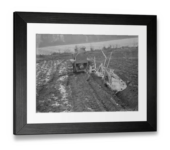 Framed Print : A ploughing demonstration with the new Melotte tractor fitted with continuous tracks