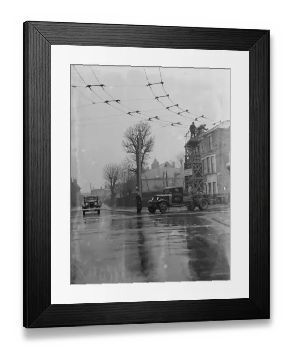Framed Print : Workers from the Demolition and Construction Company Ltd use their Bedford Tram Tower Framed Print : Workers from the Demolition and Construction Company Ltd use their Bedford Tram Tower