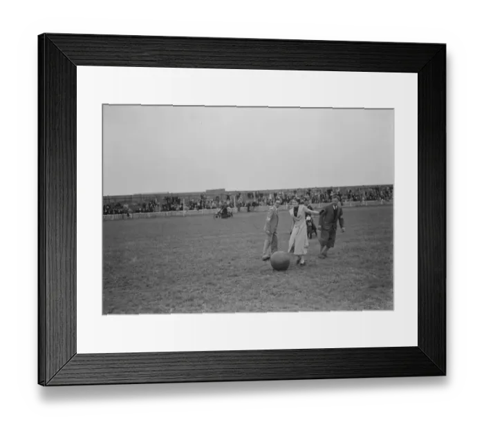 Framed Print : The Gravesend and District Motor Cycle Gymkhana in Kent. A woman kicking a ball around