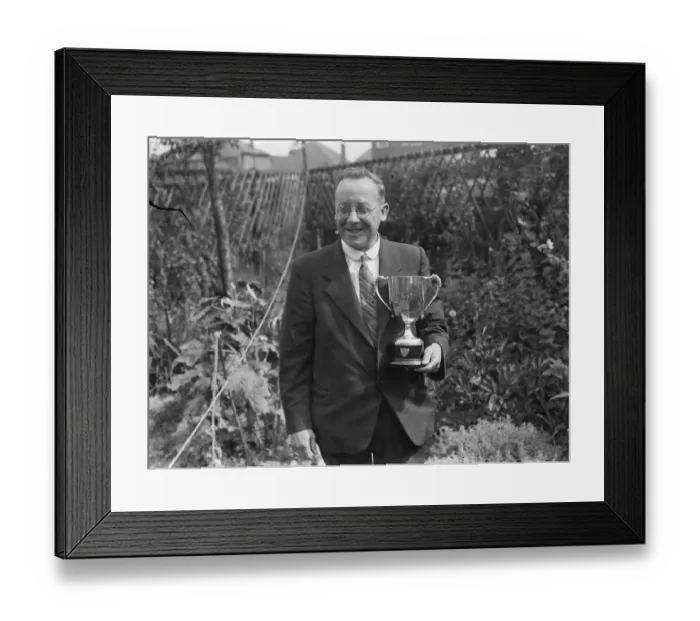Framed Print : A W Costley, the Secretary of Crayford Horticultural Society, posing with his trophy