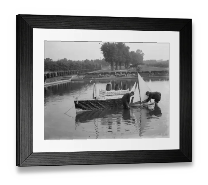 Framed Print : Model of the liner RMS Queen Mary is released upon the the water alongside a model yacht Framed Print : Model of the liner RMS Queen Mary is released upon the the water alongside a model yacht