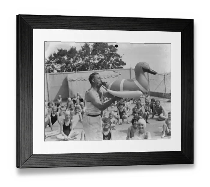 Framed Print : The Swanscombe Baths in Kent. Mr Bahalane blows up a swimming pool inflatable Framed Print : The Swanscombe Baths in Kent. Mr Bahalane blows up a swimming pool inflatable