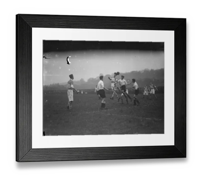 Framed Print : Boys football, two players compete for an aerial ball. 1935 Framed Print : Boys football, two players compete for an aerial ball. 1935