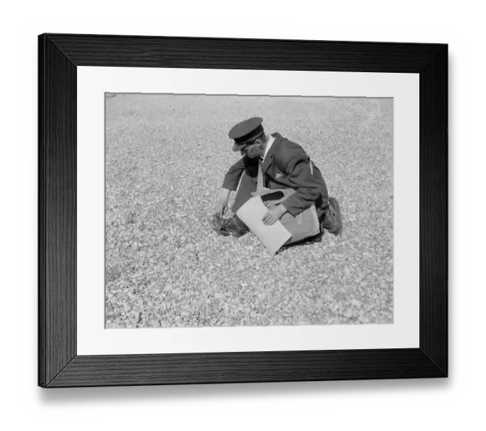 Framed Print : Mr Freathy, the postman at Dungeness, puts on wooden beach shoes to help him walk Framed Print : Mr Freathy, the postman at Dungeness, puts on wooden beach shoes to help him walk