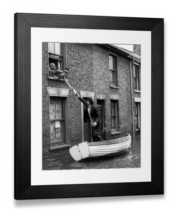 Framed Print : Bill Washford in a boat outside his house in Clyde Street Sheerness Kent fetch supples Framed Print : Bill Washford in a boat outside his house in Clyde Street Sheerness Kent fetch supples