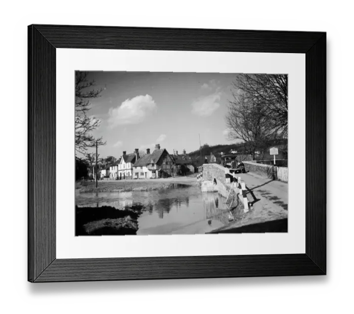 Framed Print : A view of Eynsford with a car coming over the bridge by the ford over the River Darent Framed Print : A view of Eynsford with a car coming over the bridge by the ford over the River Darent