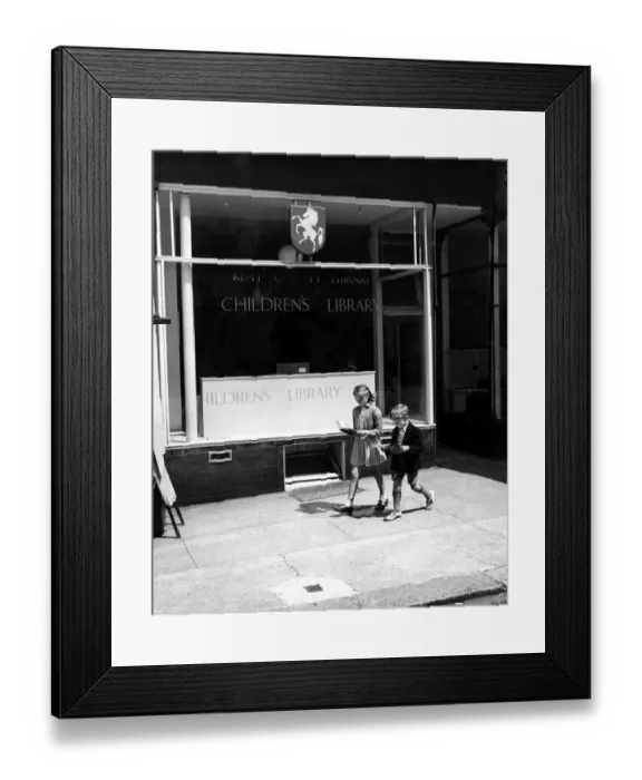 Framed Print : Kent County Library Childrens Library Two young children can t wait to get home