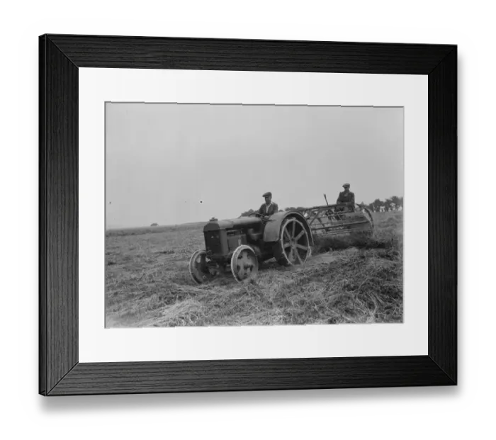 Framed Print : Farmers using a new tractor drawn haymaking machine on a field in Farningham, Kent Framed Print : Farmers using a new tractor drawn haymaking machine on a field in Farningham, Kent