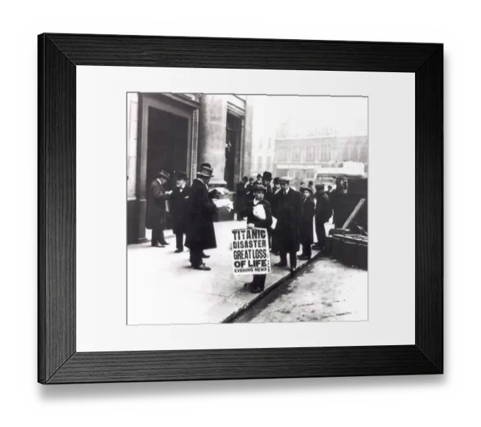 Framed Print : A newspaper boy spreads the news of the sing of the Titanic to bystanders outside Framed Print : A newspaper boy spreads the news of the sing of the Titanic to bystanders outside