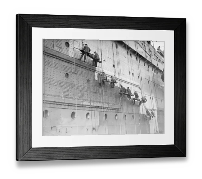 Framed Print : Painters are at work on the huge task of painting the hull of the Cunard White Star Framed Print : Painters are at work on the huge task of painting the hull of the Cunard White Star