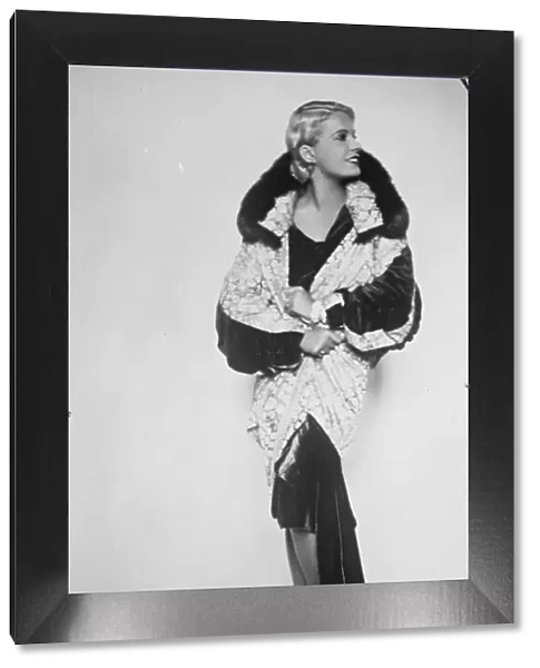 Lili Damita, wearing the magnificent silver brocade coat presented by Jenny. 24