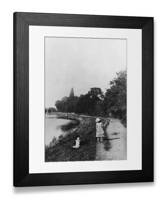 Framed Print : Two girls playing by the river bank, one girl with her hoop ready for rolling Framed Print : Two girls playing by the river bank, one girl with her hoop ready for rolling