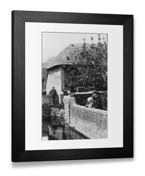 Framed Print : Two young girls stop to admire the view on a walk with their grandfather