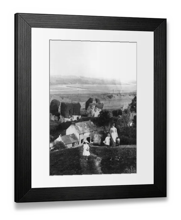 Framed Print : A mother and her girls climb the steep hill at the back of their garden to fetch water Framed Print : A mother and her girls climb the steep hill at the back of their garden to fetch water