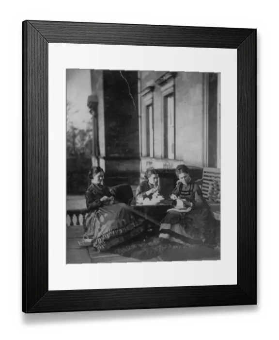Framed Print : Mother and daughters enjoy their tea outdoors in the afternoon sun Framed Print : Mother and daughters enjoy their tea outdoors in the afternoon sun