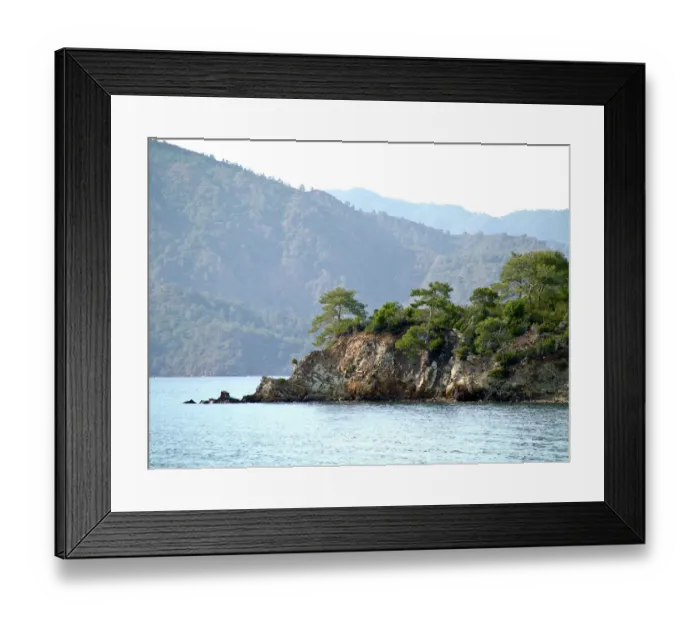Framed Print : Rocky promontary with mountain backdrop on south Turkish coast near Fethiye Framed Print : Rocky promontary with mountain backdrop on south Turkish coast near Fethiye