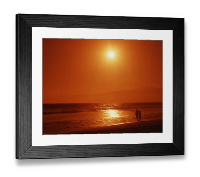 Framed Print : Couple on tropical beach, shortly before sunset